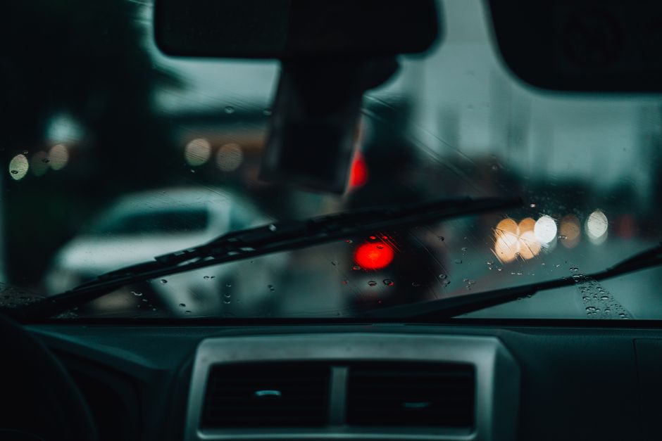 Close up of a cracked car windshield needing repair